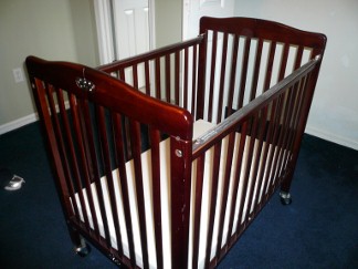 The crib is a full size wood crib